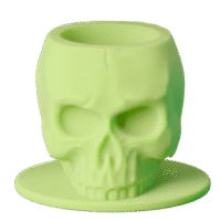 Silicone skull-shaped tattoo ink cups in vibrant colors, designed to protect needles and provide precision during tattooing.