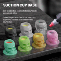 Silicone skull-shaped tattoo ink cups in vibrant colors, designed to protect needles and provide precision during tattooing.