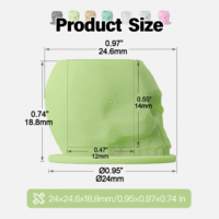 Silicone skull-shaped tattoo ink cups in vibrant colors, designed to protect needles and provide precision during tattooing.